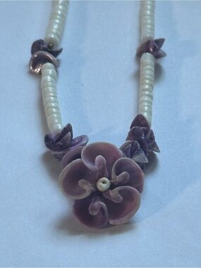 Natural purple clam shell necklace. No chips or cracks in flower